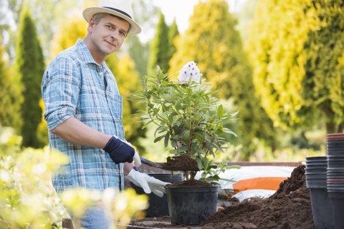 Workers using protective gear while pruning